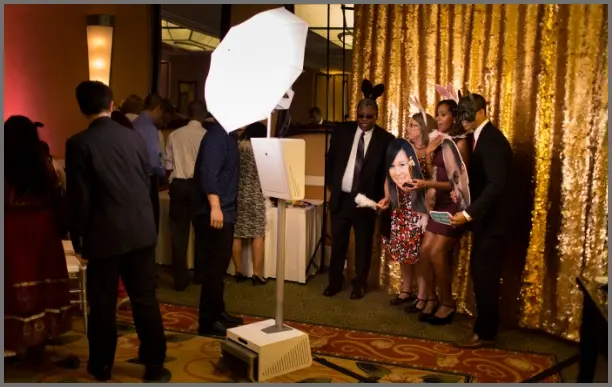 Photo booth print strips with guests posing