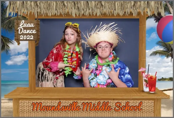 Students posing at school event photo booth